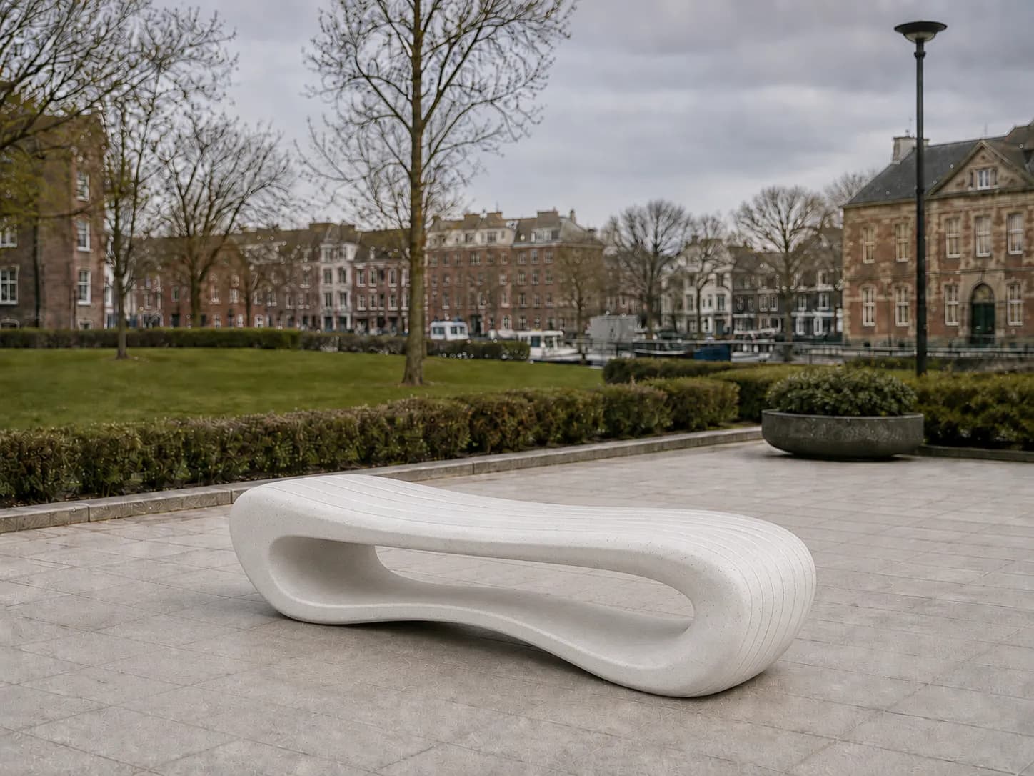 Auro Arc Bench — in context — off-white concrete + iroko